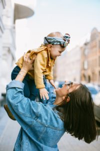 mother-carrying-her-daughter-3662773